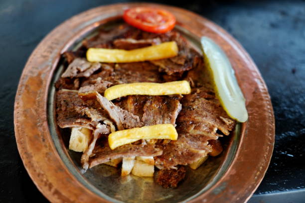 Enjoy juicy meat with fresh vegetables and a generous drizzle of rich, flavorful sauce