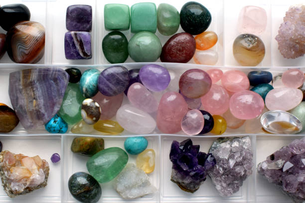 Collection of gemstones in a plastic box. Hobby healing crystals