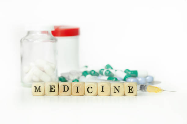 istock Tablets with syringe and the written word medicine 2196029160