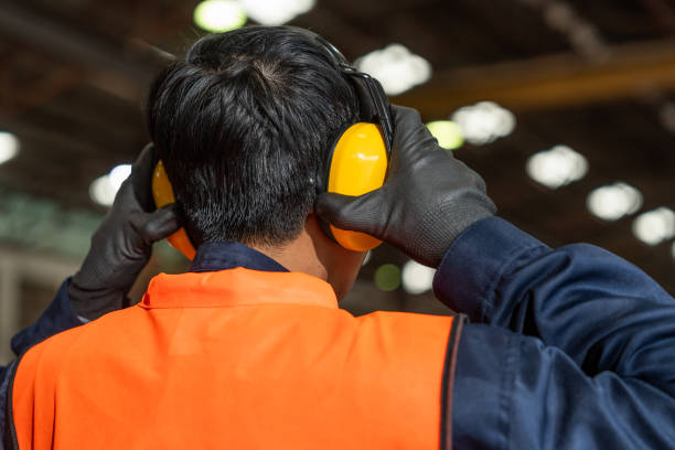 istock Close up technician engineer wearing and adjust protective safety ear plug Safety equipment for industry factory. Safety at work concept. 2196030837