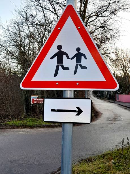 istock Road sign with running people 2196035318