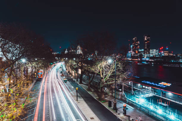 istock London cityscape at night with light trails and river thames 2196036882