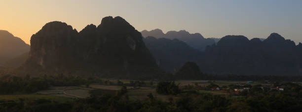 istock Mountain ranges at sunset, Vang Vieng, Laos. 2196037141