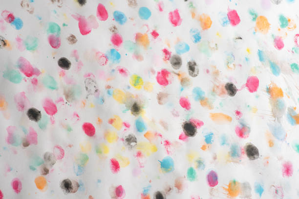 This image showcases a vibrant arrangement of colorful watercolor painted dots on a white background, creating an abstract and lively atmosphere perfect for creative projects.