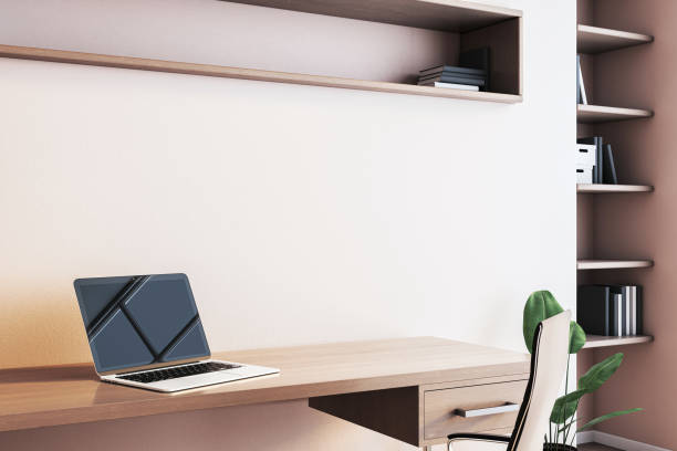 istock Modern workspace with laptop on wooden desk and shelving in light home interior. 3D Rendering 2196039315