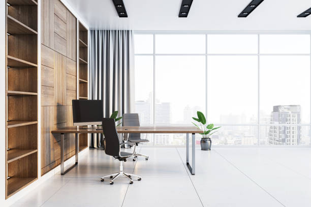 istock Modern minimalist office interior with wooden shelves and large windows. 3D Rendering 2196039321