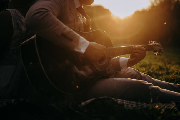 istock the groom plays the guitar 2196041557