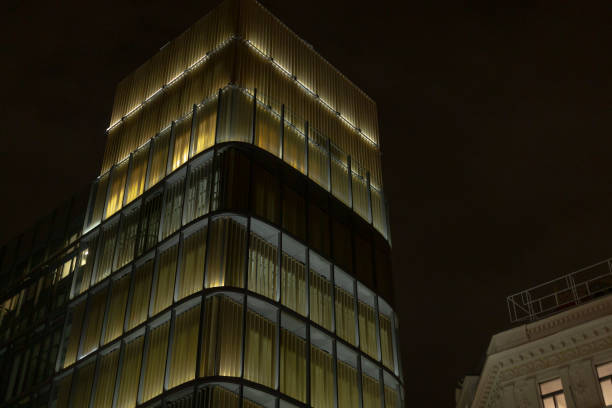 istock A tall and impressive building that has many windows is illuminated at night 2196041595