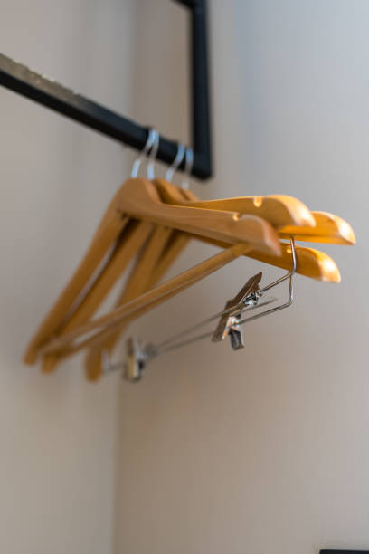 istock Wood hangers on clothes rack 2196043035