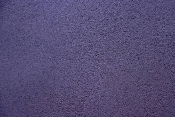 Vivid lilac wall textured surface exhibiting fine details, useful as a decorative element or design background.