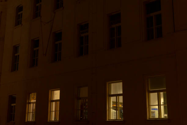 istock The Illuminated Windows of a Dark Building at Night Create a Stunning View 2196044204