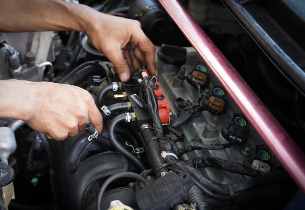 istock Hands man auto mechanic tuner LPG system of car engine on car engine background for maintenance or repair service concept.Close up. 2196047308