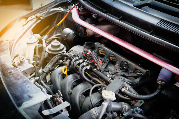 istock Tuner tool on car engine ready to check and fixed used car LPG system for save fuel and energy in car garage for maintenance, checking car or repair service concept.Close up. 2196047373