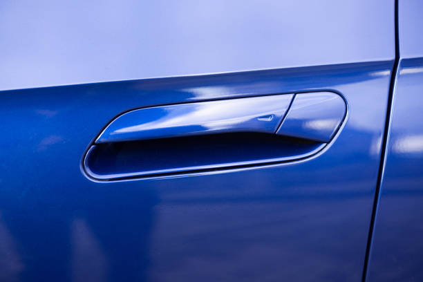 istock Keyless entry car door handle with keyless go touch sensor. Automatic opening of a car door without a key. Car door handle. Access button. Exterior design of a new electric luxury car 2196051924