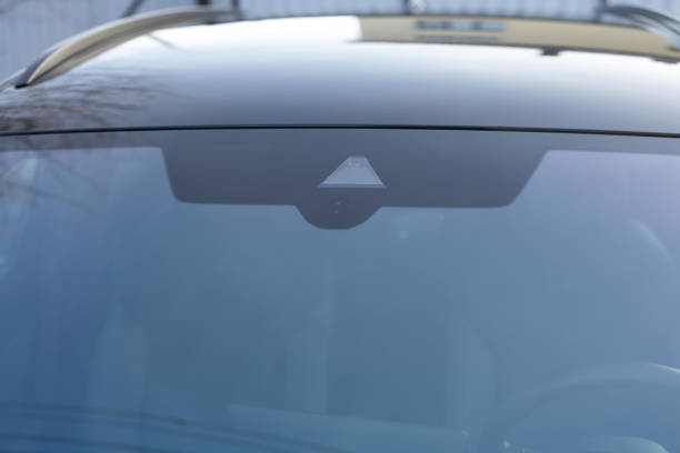 istock Close up view of modern driver assistance. Car System Intelligence - Surround View 360 Degrees Bird Eye View, Line Assist, Front Camera. Rain and light sensor on the windshield of the car. 2196053410
