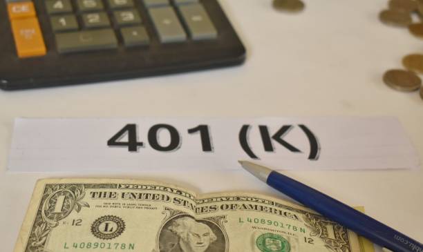 istock 401k plan with a coins, bank bills and calculator. 2196053785