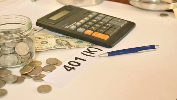 istock 401k plan with a coins, bank bills and calculator. 2196053789