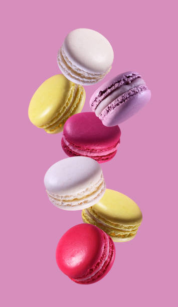 istock Colorful macaroons falling on pink background 2196054762