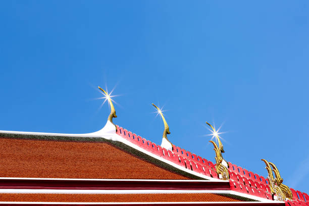 Shot in color detail on the facade of this historic building representing some character, animal or flower. Set at Bangkok, Thailand, Asia