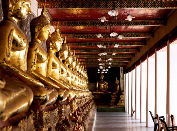 istock endless row of golden buddhas in the temple hall 2196054997