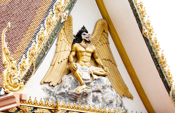 Shot in color detail on the facade of this historic building representing some character, animal or flower. Set at Bangkok, Thailand, Asia