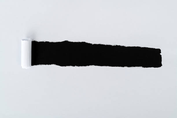 istock White paper tearing a hole 2196056212