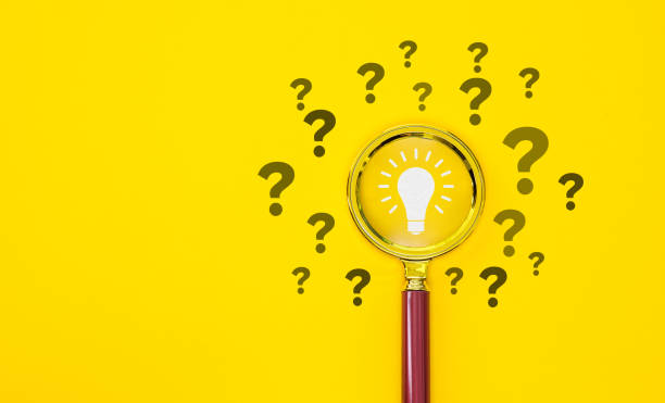 istock Magnifying glass with light bulb icon and question mark symbol on orange background 2196056298