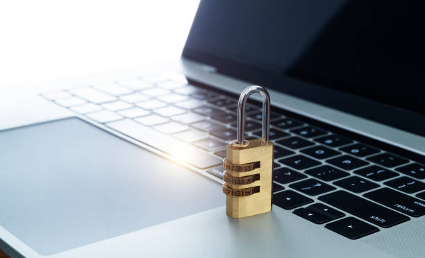 istock Golden padlock on laptop keyboard 2196056369