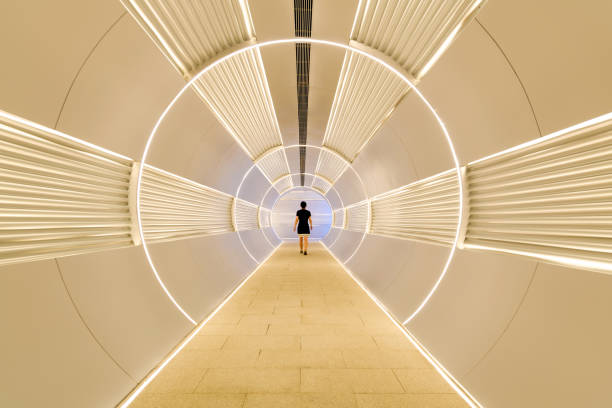 istock Woman walking in corridor tunnel 2196057335