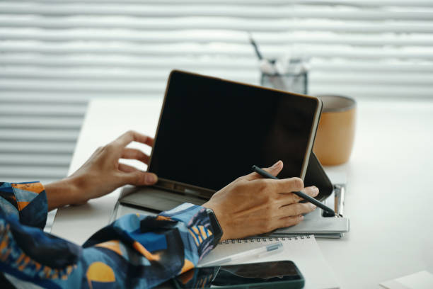 istock Unrecognizable Woman Using Digital Tablet and Stylus 2196057904