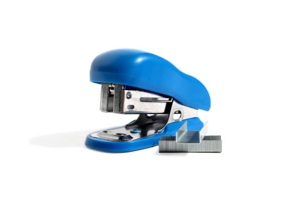 A blue small office stapler is located on a white background.