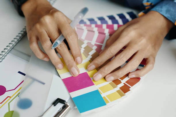 istock Female Designers Hands Choosing Colors 2196062482