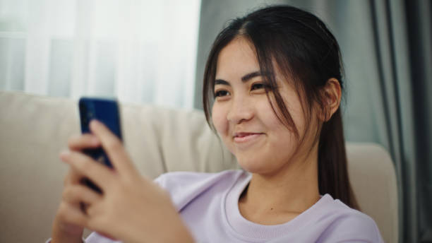 istock Teenage girl using smartphone. 2196067525