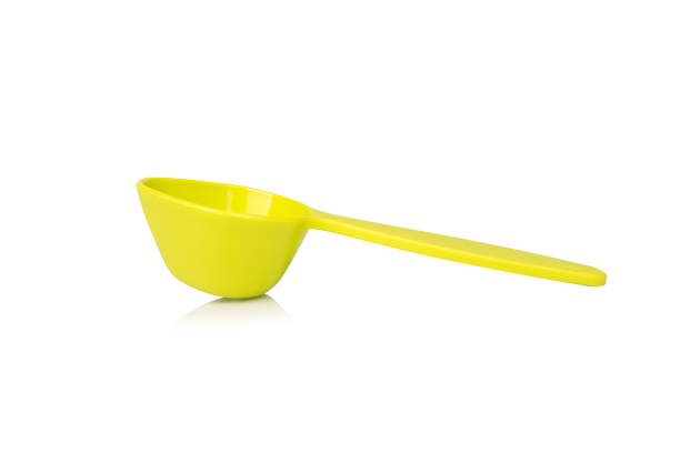 istock Green measuring spoon isolated on white background 2196067732