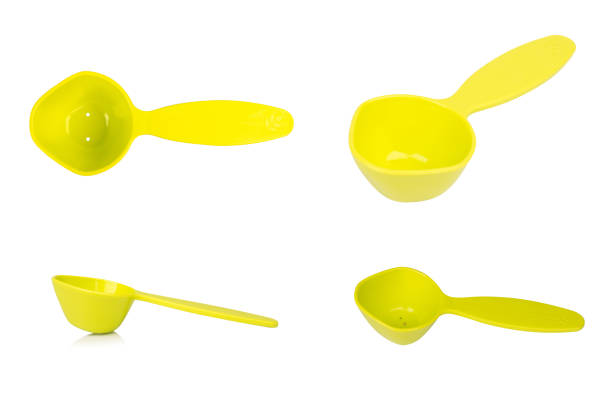 istock Green measuring spoon isolated on white background 2196067739