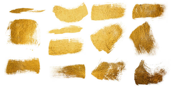 istock Strokes of golden paint isolated on white background 2196068044