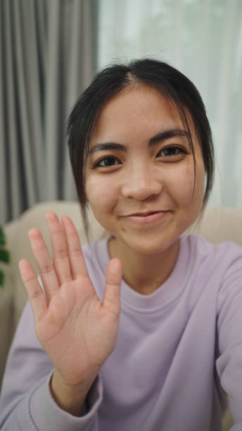 istock Teenager friendly greeting on a video call. 2196071059