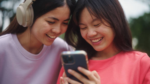 istock Asian teenagers watching on smartphone. 2196071837