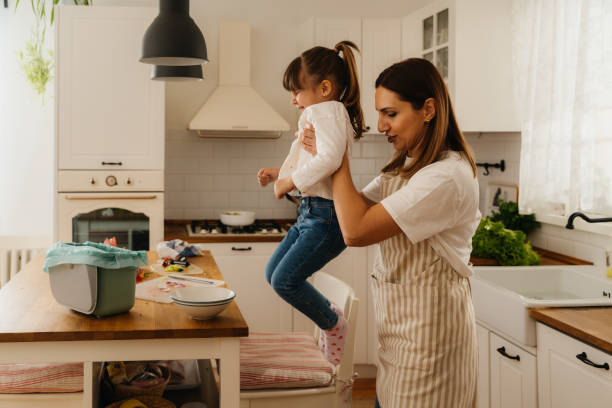 istock Mother and Daughter Practicing Eco-Friendly Kitchen Habits 2196072229
