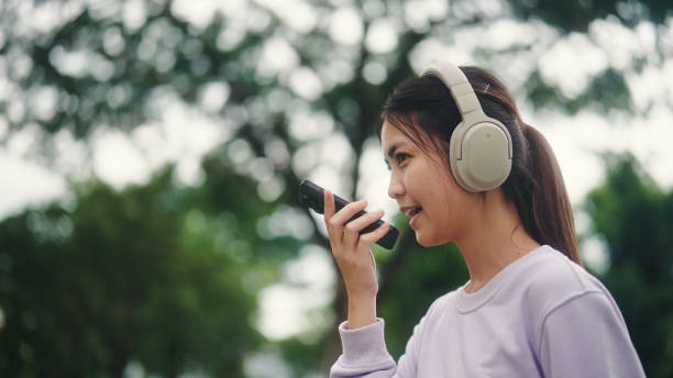 istock Young woman use ai voice assistant while travel. 2196072544