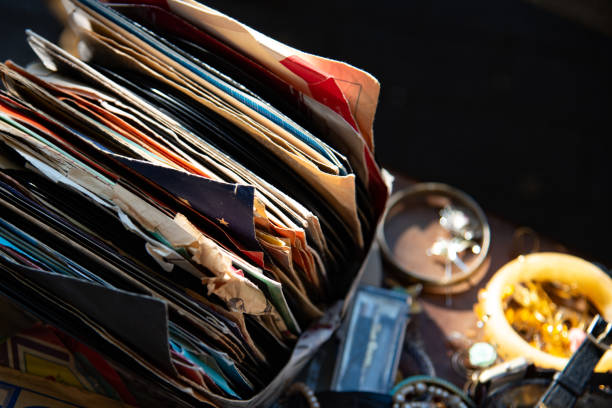 People looking and searching old vinyl records in flea or second hand market.