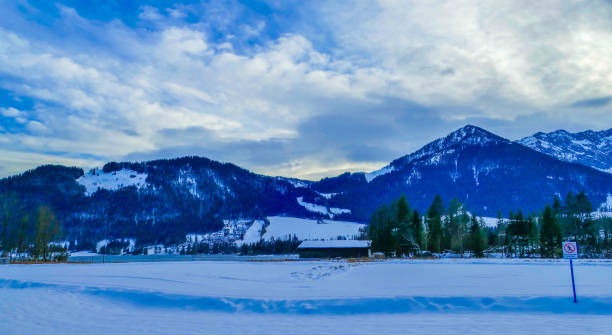 istock Snowy Pasture in Front of Mountains Walchsee Austria 2196074948