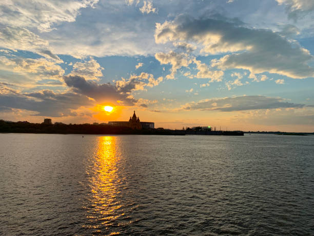 istock The sun is setting over the water 2196075379