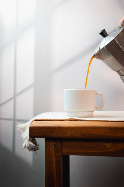 istock Cup of coffee on a minimalist background 2196078863
