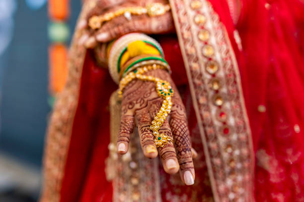 istock Indian bride's wedding henna mehendi mehndi hands close up 2196079012