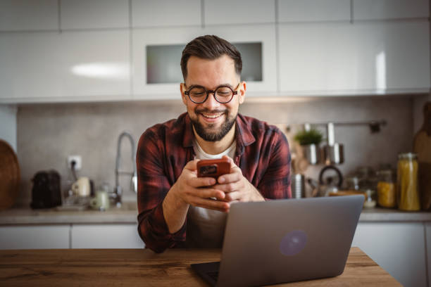 istock adult man work from home and take a break on mobile phone 2196079686