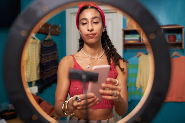 istock Young Blogger Standing In Front Of Ring Lamp 2196081356