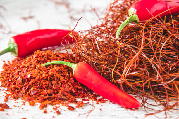 istock Chili pods, flakes and threads on white background 2196087445