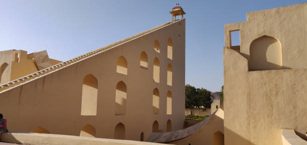 istock A building with a steeple and arched windows. Jantar Mantar in Jaipur, India 2196087728