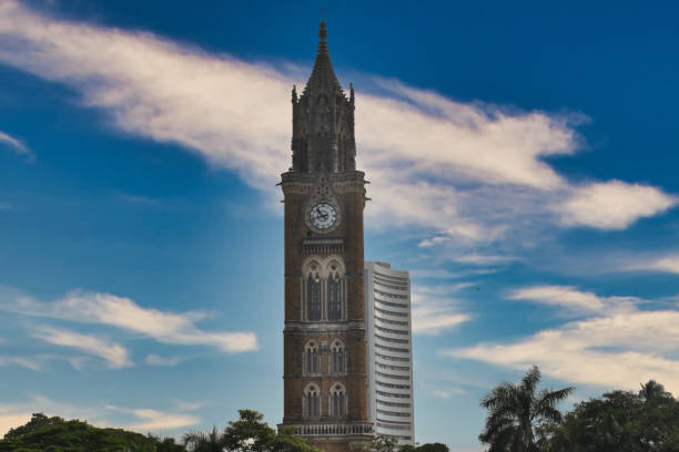 istock The iconic clock tower looms majestically while bright clouds contrast with the blue sky, showcasing Mumbai's architectural beauty 2196089063